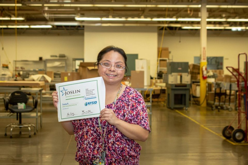 Woman recieving award for her employment